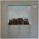 Friends Again : Trapped And Unwrapped (LP, Album)