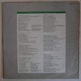 Friends Again : Trapped And Unwrapped (LP, Album)